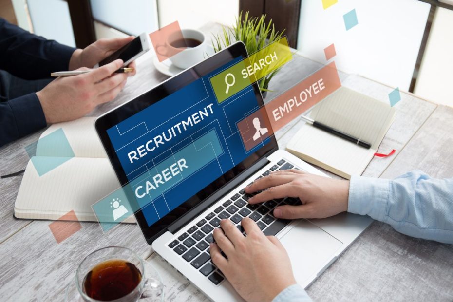 Laptop dengan tulisan "Recruitment", "Career", "Search", dan "Employee".